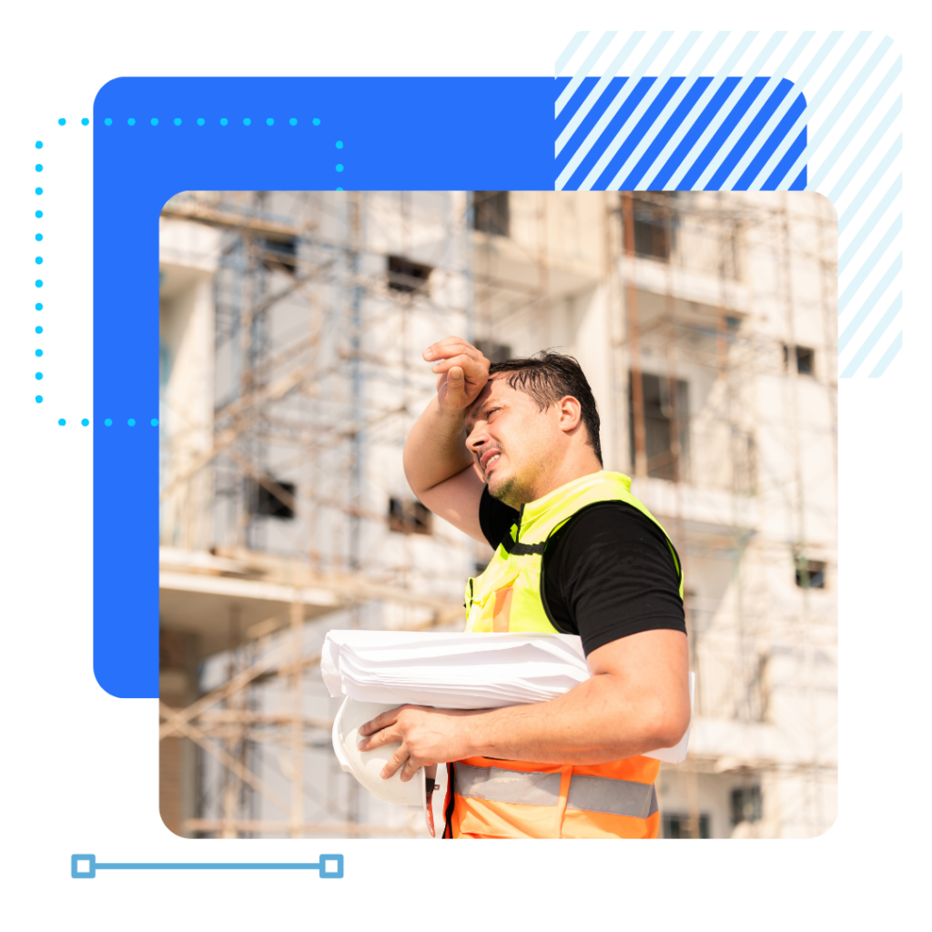 Construction worker in a safety vest wipes sweat from his brow, holding blueprints. He stands in front of a sunlit building under construction, conveying exhaustion.