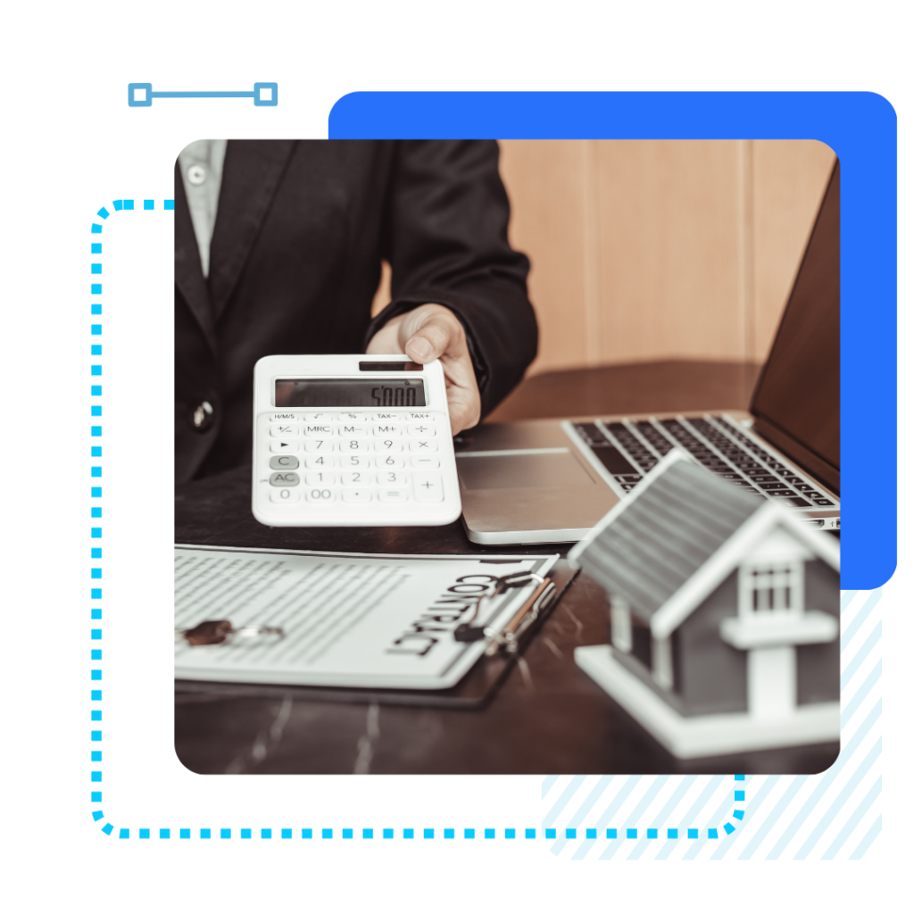 A person in a suit holds a calculator displaying "5000" next to a laptop. In the foreground, a contract with keys and a model house.